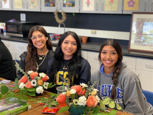 Floriculture students working on table centerpieces