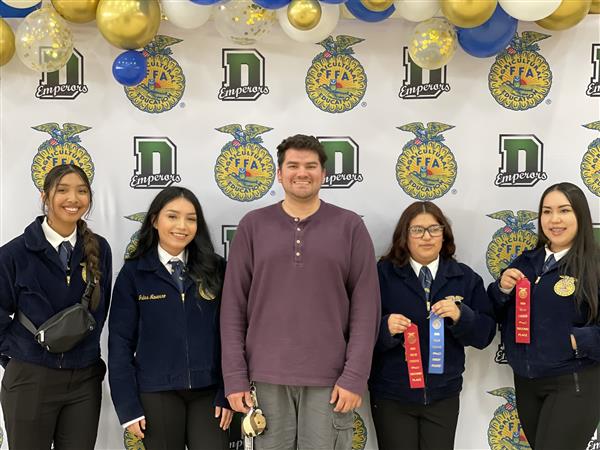 Mr. Arceo and floriculture team members with awards from the Dinuba FFA Field Day Competition