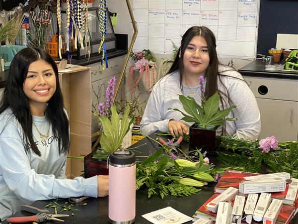 Floriculture students working on table centerpieces